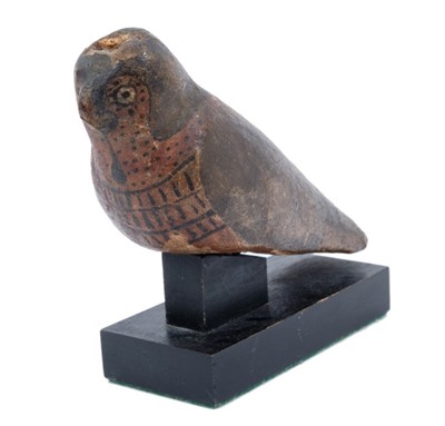 Lot 739 - Ancient Egyptian painted wooden gesso figure of a falcon, 26th Dynasty, 6th century B.C.