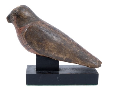 Lot 739 - Ancient Egyptian painted wooden gesso figure of a falcon, 26th Dynasty, 6th century B.C.