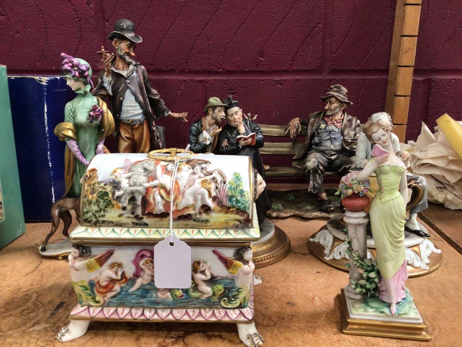 Lot 525 - Capodimonte Tramps, ladies, priest, old man reading and chest style box