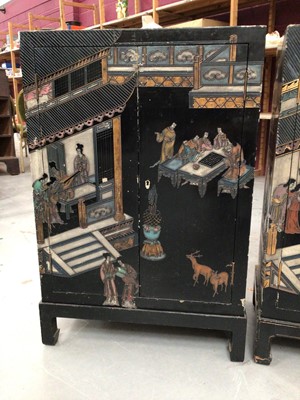 Lot 855 - Pair of Chinese black lacquered and chinoiserie decorated cabinets together with a consol table