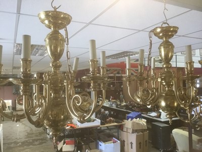 Lot 296 - Two large contemporary brass chandeliers