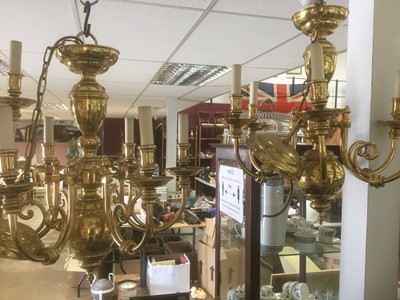 Lot 297 - Two large contemporary brass chandeliers