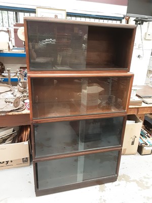 Lot 890 - Simplex four section library bookcase in Dark Oak, with label to interior