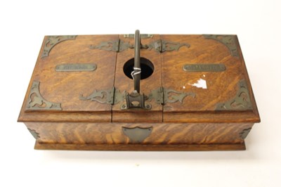 Lot 329 - Edwardian oak combination cigar and cigarette dispenser