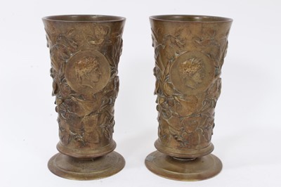 Lot 747 - Pair of 19th century cylindrical bronze goblets with floral decoration