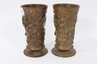Lot 747 - Pair of 19th century cylindrical bronze goblets with floral decoration