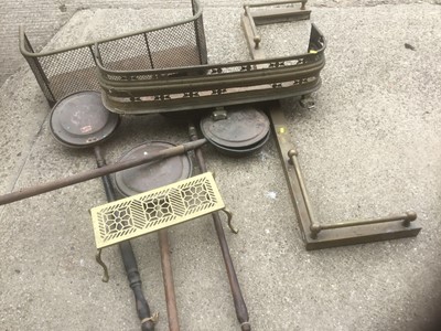 Lot 252 - Three brass fenders, bed pans and a trivet