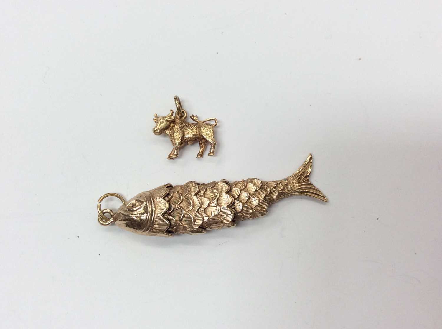 Articulated fish pendant on sale meaning