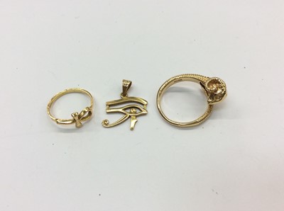 Lot 677 - Egyptian gold cross ring, Egyptian gold Eye of Horus pendant and an Eastern gold rams head ring