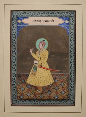 Lot 765 - Indian painting of a Jaipur nobleman In yellow embroidered robes, holding a rose, standing on a carpet, within ornamental painted border, framed and glazed, late Mughal school, probably Rajahstan c...