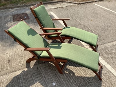 Lot 947 - Pair of modern teak steamer chairs of typical form, with green fabric cushions
