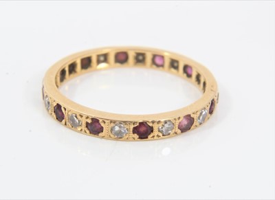 Lot 478 - Ruby and diamond eternity ring
