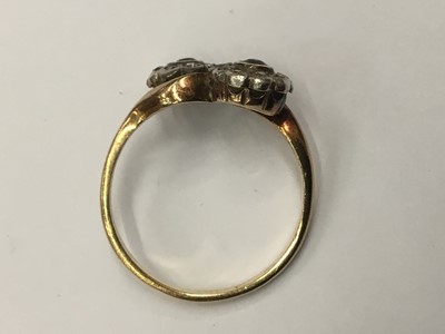 Lot 687 - Edwardian sapphire and diamond double flower head cluster ring with cross-over setting on yellow gold shank. Finger size O.