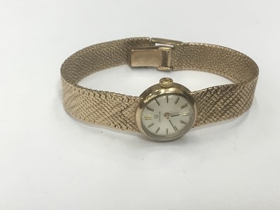 Lot 692 - Lady's Omega 9ct gold wristwatch on integral gold Milanese bracelet