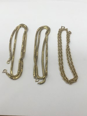 Lot 697 - Two lengths of Victorian yellow metal snake link chains and a yellow metal necklace