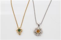 Lot 1506 - Emerald and diamond cross pendant on chain...