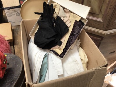 Lot 34 - A box of linen, together with vintage pairs of kid gloves, three vintage ladies hats in a Scott's hat box, and two collapsible top hats in a tin hat box
