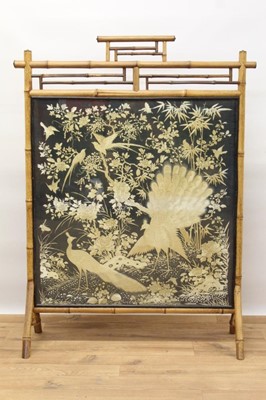 Lot 1450 - Fine 19th century fire screen with a finely embroidered Chinese silk panel depicting a peacock and pea-hen, exotic birds and butterflies amongst foliage, in a bamboo frame