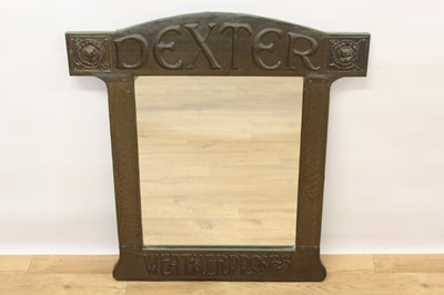 Lot 1402 - Rare Arts & Crafts advertising mirror for Dexter Waterproofs in an oxidised embossed metal frame