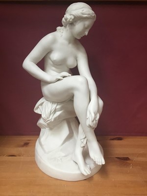 Lot 204 - 19th century Parian porcelain sculpture of seated female nude, approximately 38cm.
