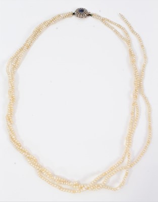 Lot 546 - Three row seed pearl necklace with sapphire and diamond clasp in original box (one string broken)