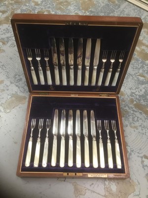 Lot 295 - Cased Mother of Pearl handles with silver bandking twelve fruit knives and twelve fruit forks