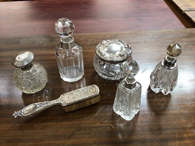 Lot 705 - Selection of silver topped perfume bottles, cream jar and monogrammed hair brush (6)