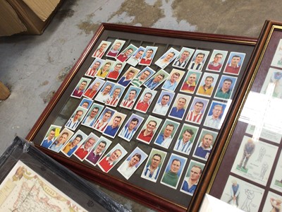 Lot 45 - Players Association footballers cigarette cards, together with other cards in a glazed frame, reproduction map and other pictures
