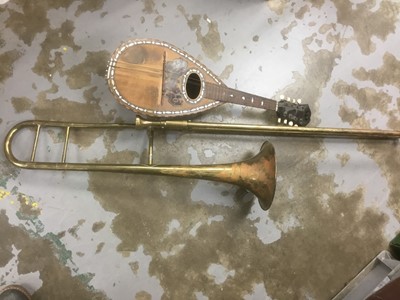 Lot 436 - Brass tenor trombone together with a mandolin (2)