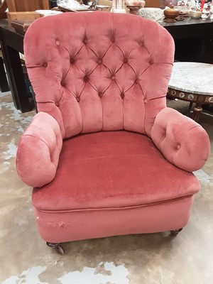 Lot 999 - Victorian buttoned back armchair on turned legs with ceramic castors and a Victorian side chair on turned mahogany legs with brass castors (2)