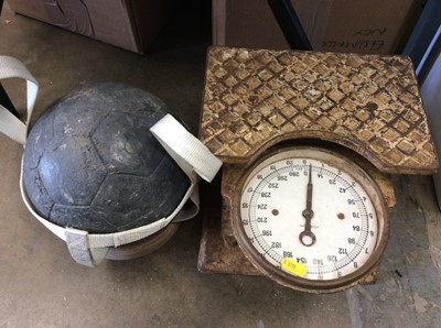 Lot 460 - Solid lead model football weighing approximately 9 stone, together with a pair of vintage weighing scales