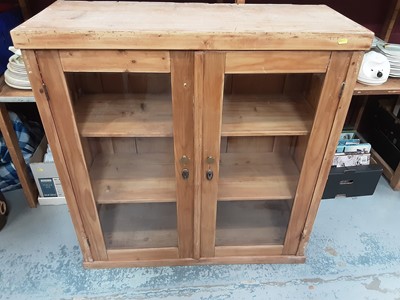 Lot 891 - Pine bookcase with shelved interior enclosed by two glazed doors, 97cm wide, 38.5cm deep, 100.5cm high