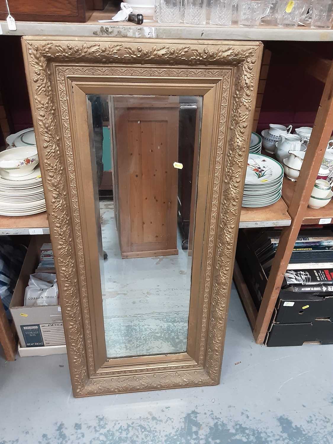 Lot 899 - Wall mirror in ornate gilt frame, 53.5cm wide, 115cm high