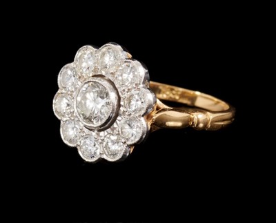 Lot 462 - Diamond cluster ring with a flower head cluster of eleven brilliant cut diamonds