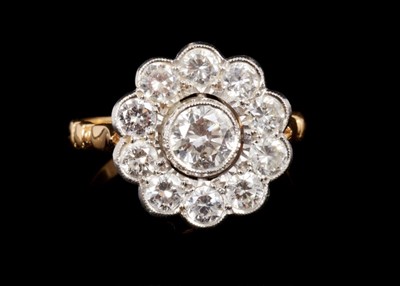 Lot 462 - Diamond cluster ring with a flower head cluster of eleven brilliant cut diamonds