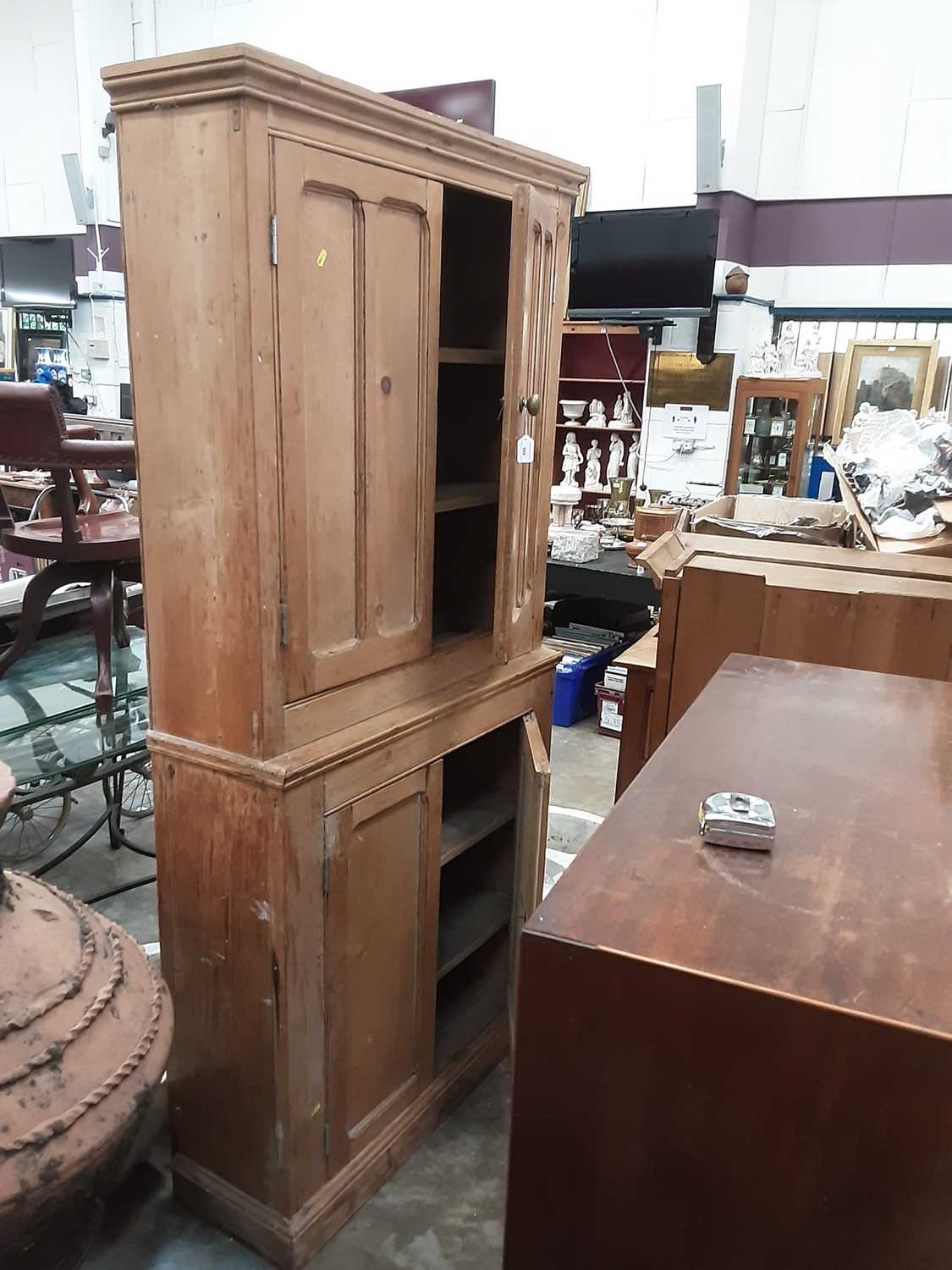 Lot 909 - Large pine bookcase with shelved interior enclosed by four panelled doors, 96cm wide, 32cm deep, 197cm high