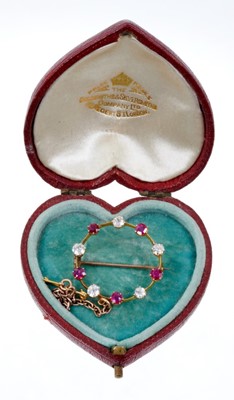 Lot 547 - Edwardian diamond and ruby circular brooch, possibly Burma origin