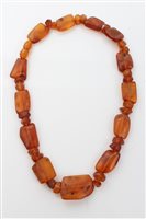 Lot 1533 - Old amber bead necklace - consisting of...