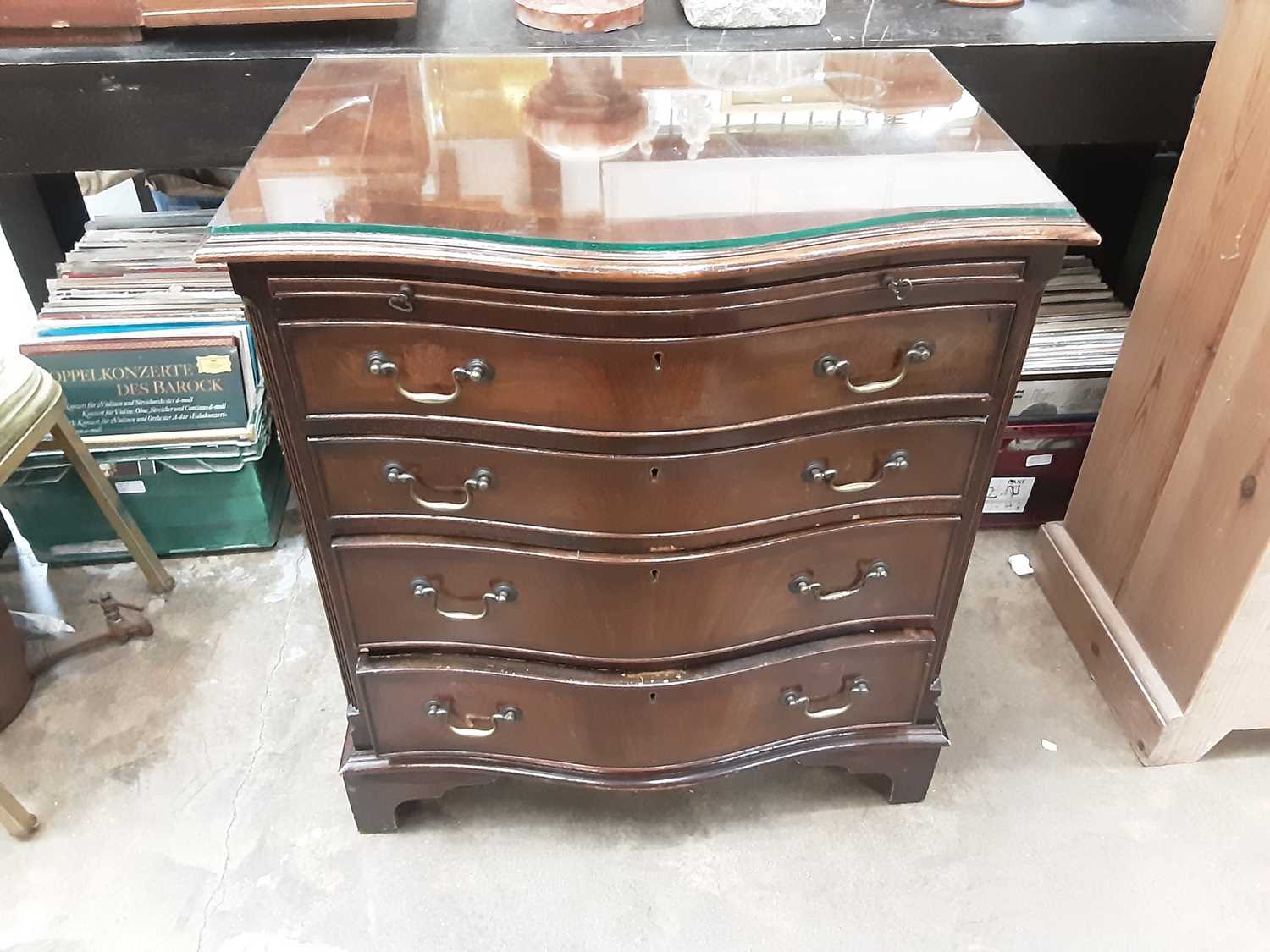 Lot 934 - Georgian style mahogany serpentine fronted chest with brushing slide and four long graduated drawers on bracket feet, 71cm wide, 50cm deep, 78cm high
