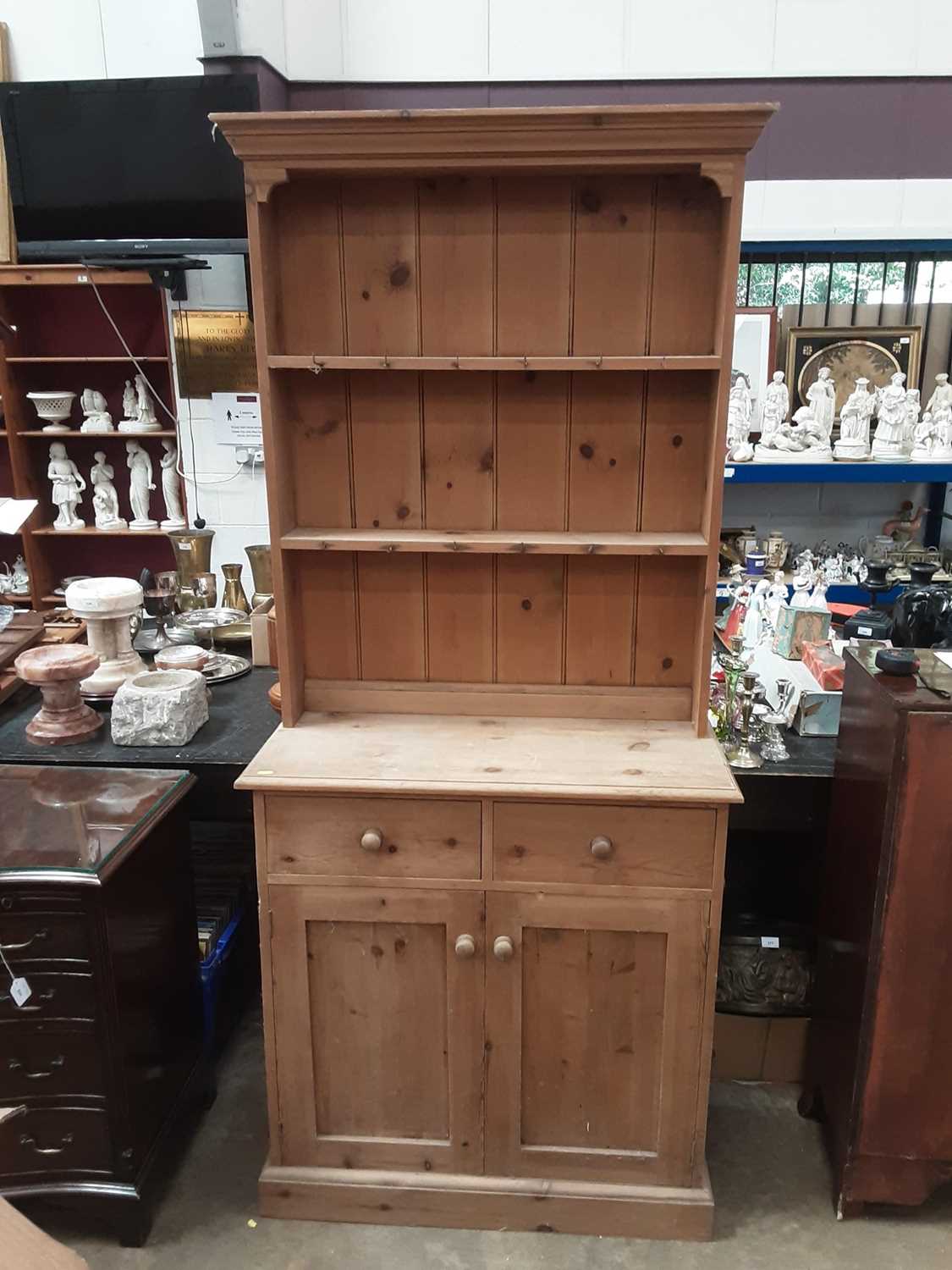 Lot 935 - Pine two height dresser with shelves above, two drawers and two panelled doors below, 90cm wide, 38cm deep, 199cm high