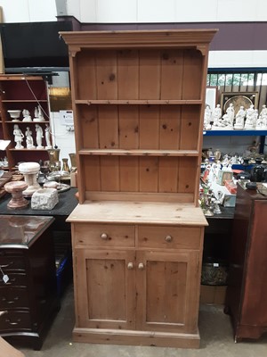 Lot 935 - Pine two height dresser with shelves above, two drawers and two panelled doors below, 90cm wide, 38cm deep, 199cm high