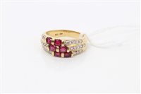 Lot 1534 - Gold (18ct) ruby and diamond set three band...