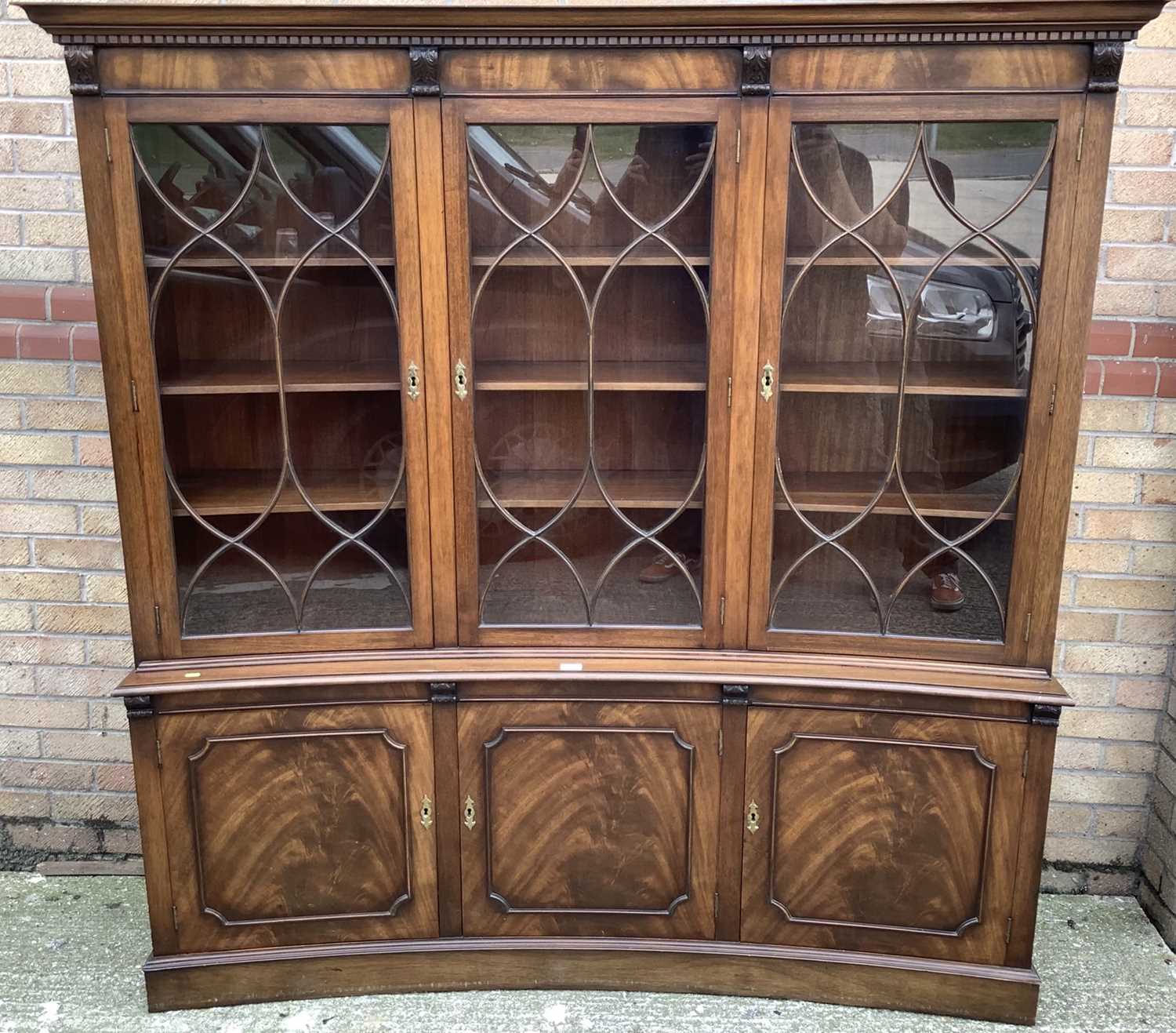 Lot 939 - Good quality Georgian style mahogany concave fronted two height with three astragal glazed doors above, and three cupboards below, 178cm wide, 43.5cm deep, 183cm high