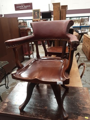 Lot 965 - Edwardian revolving desk chair with padded back and arms, polished solid mahogany sear on four hipped splayed legs