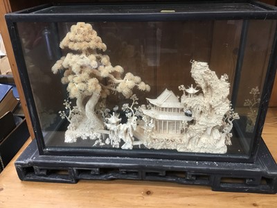 Lot 301 - Chinese carved cork diorama depicting temples and trees in landscape, in a glazed case