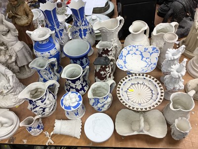 Lot 357 - Group of 19th century Parian porcelain, mostly relief moulded and coloured wares