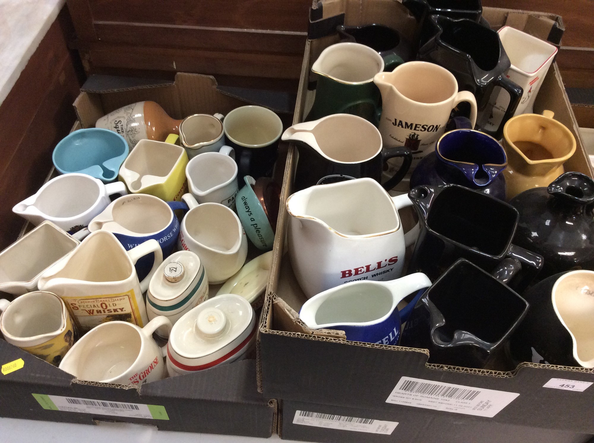 Lot 453 - Large collection of pub advertising jugs,