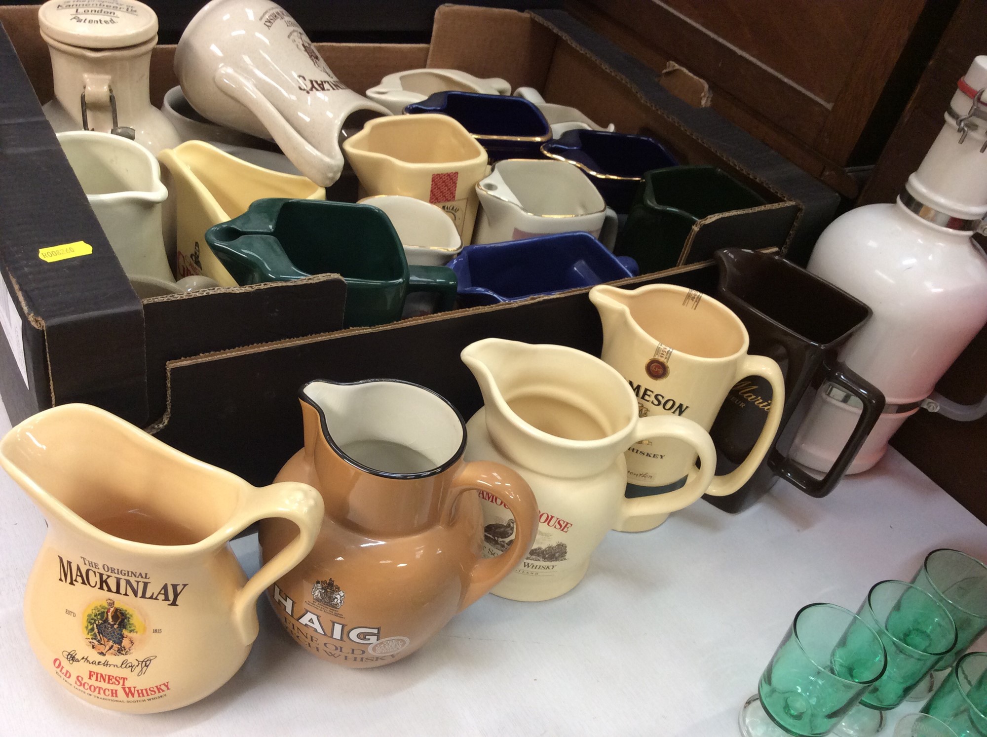 Lot 453 - Large collection of pub advertising jugs,