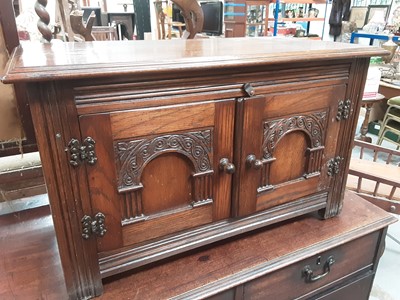 Lot 980 - Oak cabinet with two carved panelled doors, 81cm wide, 41cm deep, 49cm high