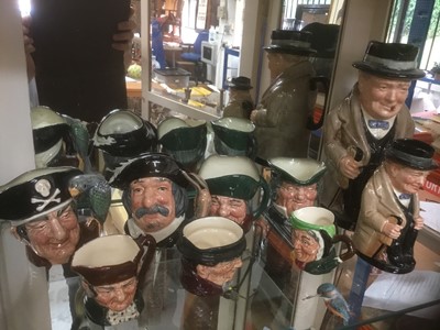 Lot 289 - Two Winston Churchill character mugs the largest 22cm high, and seven other Royal Doulton character jugs